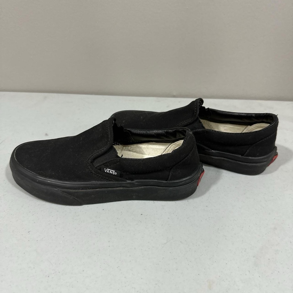 all black slip on vans